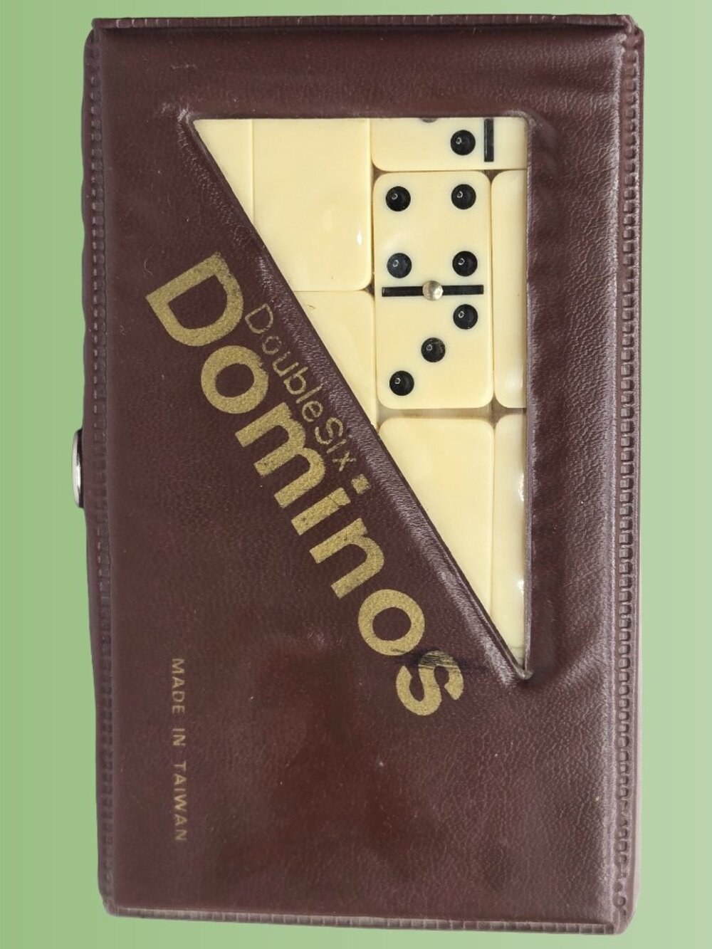 Double-Six Dominoes Set in a brown leatherette travel case metal spinners